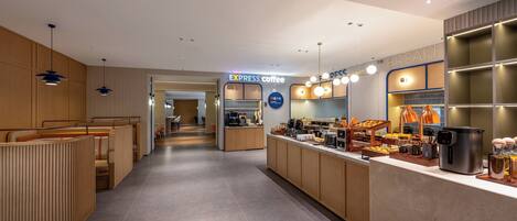 A modern coffee shop with a long counter, seating area, and a visible sign for 'EXPRESS coffee'.