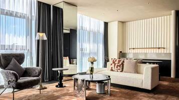 Suite, 1 Bedroom (Living and Dining Area) | Minibar, in-room safe, individually decorated, iron/ironing board