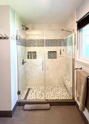 Shower, towels, soap, toilet paper