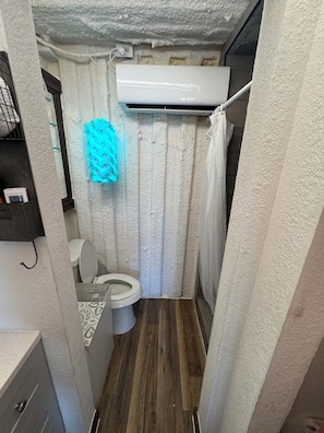 Shower, towels, soap, toilet paper