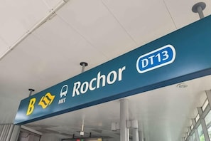 A sign with the name 'Rochor' and 'DT13' indicating a location or area.