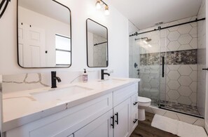 Shower, hair dryer, towels, soap