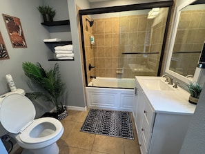 Shower, hair dryer, towels, soap
