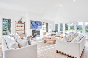 Smart TV, fireplace, table football, books