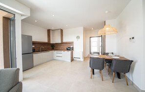 Fridge, stovetop, dishwasher, coffee/tea maker