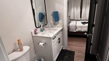 Shower, hair dryer, towels, toilet paper