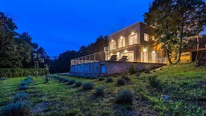 A two-story house with a balcony, surrounded by greenery and trees. - Cozy home in Cetina with private swimming pool, can be inside or outside (Cetina)