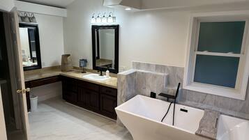 Jetted bath, hair dryer, bidet, towels