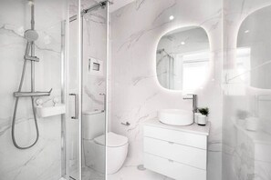 Shower, hair dryer, towels, toilet paper