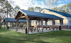 A park with wooden picnic shelters and benches. - Cozy Condo W/ Balcony at Myrtlewood Golf (Myrtle Beach)