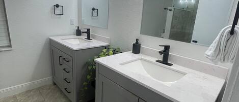 Shower, hair dryer, towels, soap