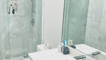 Shower, hair dryer, towels, soap