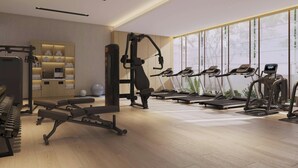 A modern gym with exercise equipment, a piano, and a reception area. - Fairfield By Marriott Yinchuan Xingqing (Yinchuan)
