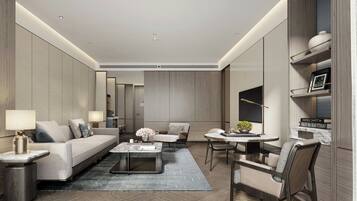 Suíte luxo, 1 cama King, vista para a cidade | Sala de estar