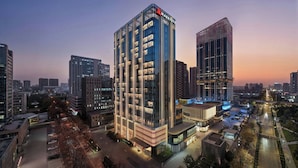 A modern hotel with a prominent Marriot logo, surrounded by other high-rise buildings in an urban setting. - Xi'An Marriott Hotel High-Tech Zone (Xi'an)