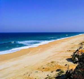 A beach with clear skies and calm waters.