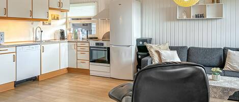 Fridge, stovetop, dishwasher, coffee/tea maker