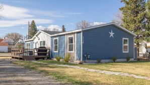 A two-story house with a deck, a star decoration on the roof, and a number '1126' on the side. - The Salsbury Star- large family home, downtown location, pet friendly (Cody)