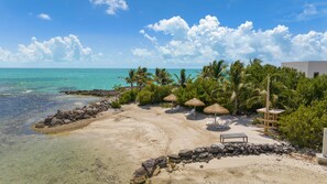 On the beach, sun loungers, beach towels