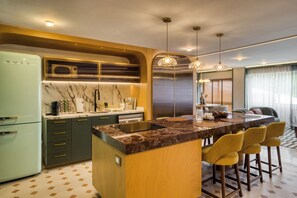 Fridge, microwave, stovetop, coffee/tea maker