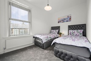 2 bedrooms, desk, iron/ironing board, travel crib