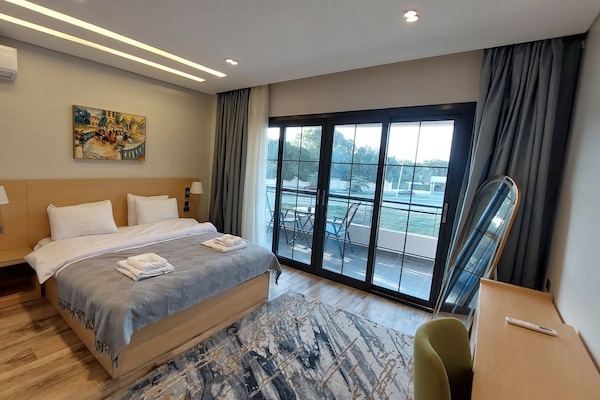 Luxury Apartment, 1 Bedroom, Balcony, Garden View | Premium bedding, laptop workspace, iron/ironing board, free WiFi