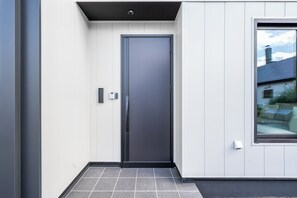 A modern exterior with a grey door, white walls, and a window. - S suzukou (Asahikawa)