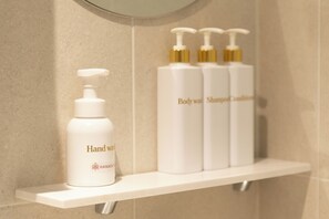 Shower, hair dryer, soap, shampoo