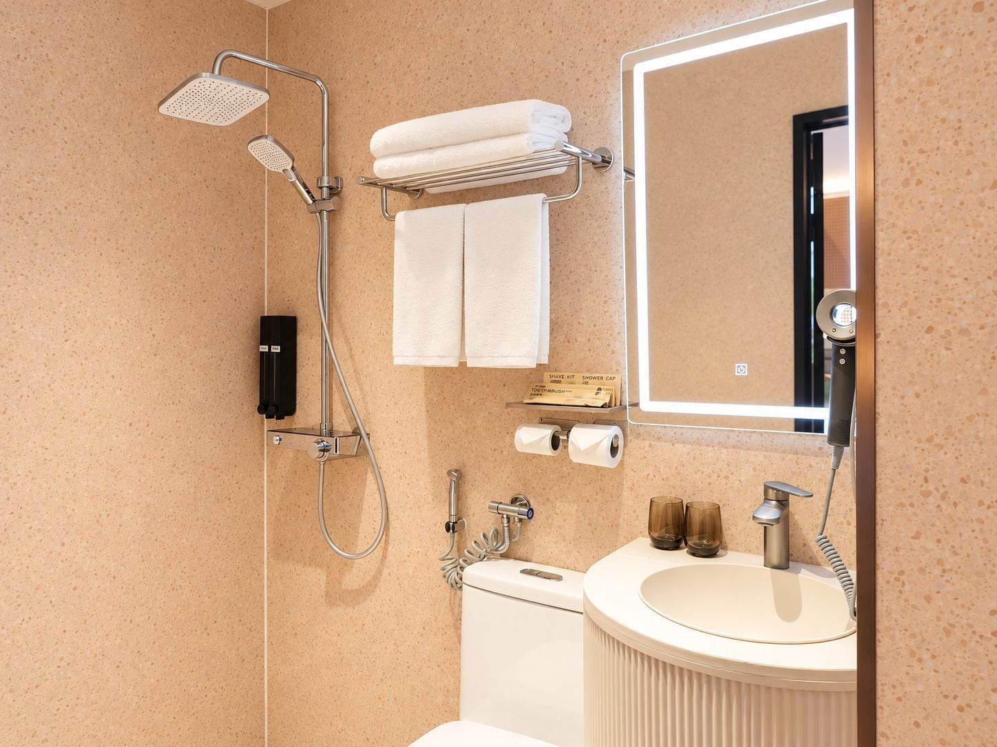 A modern bathroom with a shower, toilet, and sink.