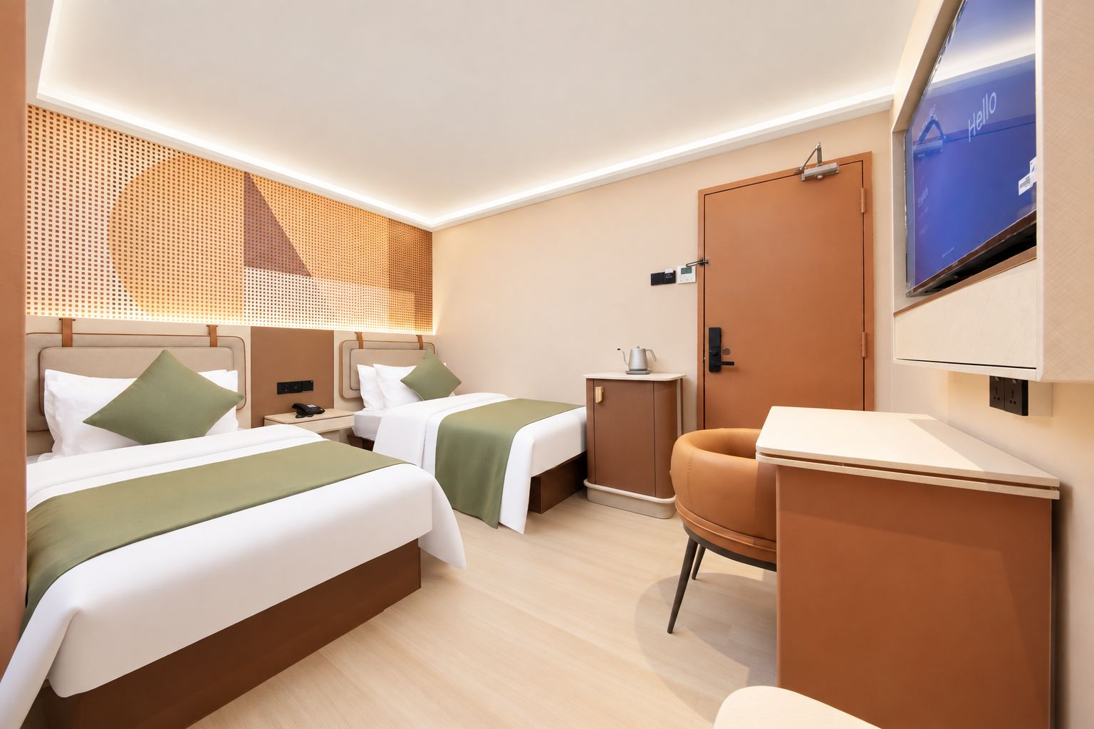 A hotel room with two beds, a desk, a chair, a TV, and a small cabinet.