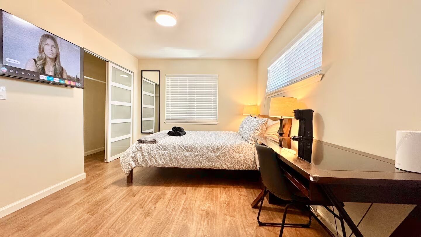 1 bedroom, desk, iron/ironing board, travel crib