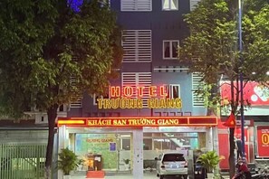 A hotel named "HOTEL TRƯỜNG GIANG" with a signboard and a storefront.