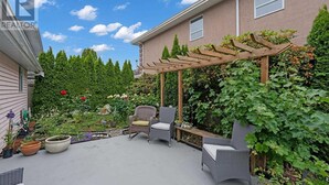 A patio with outdoor furniture, a pergola, and a garden with various plants and flowers. - Private room in home Richmond, Canada
2 guests 1 bedrooms 1 in-suite bathrooms (Richmond)