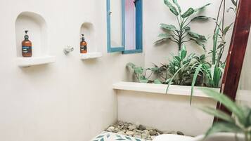 Shower, towels, soap, toilet paper