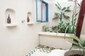 Shower, towels, soap, toilet paper