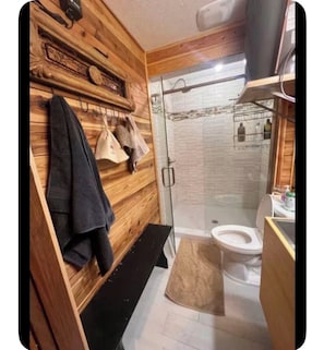 Shower, hair dryer, towels, soap