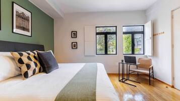 1 bedroom, desk, iron/ironing board, travel crib