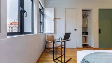 1 bedroom, desk, iron/ironing board, travel crib