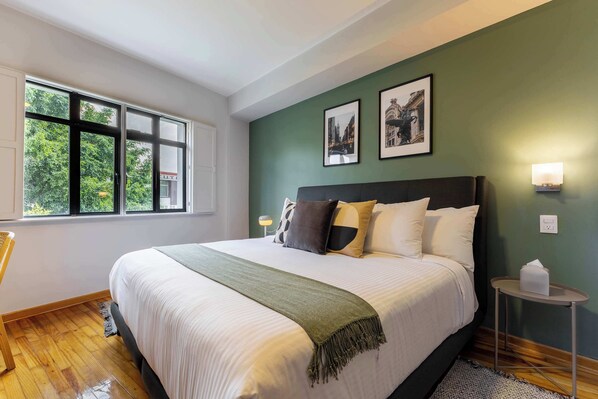 1 bedroom, desk, iron/ironing board, travel crib