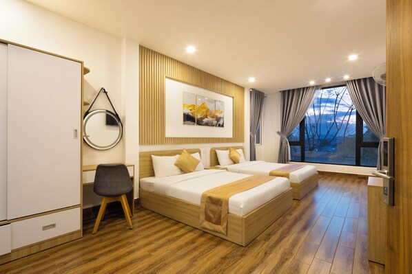 Luxury Quadruple Room | Desk, laptop workspace, blackout drapes, free WiFi