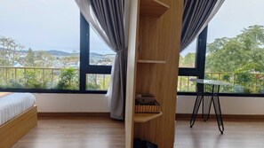 Family Triple Room | Desk, laptop workspace, blackout drapes, free WiFi - Romance Hotel (Da Lat)