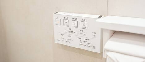 A control panel with various settings for a facility, including buttons for different functions and options for temperature and water settings.
