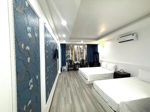 Family Room, Balcony, City View | Soundproofing, iron/ironing board, free WiFi