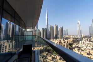 A high-rise building with a view of the cityscape, including the Burj Khalifa. - Imperial Avenue Residences - Downtown (Dubai)