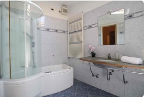 Shower, jetted tub, hair dryer, bidet