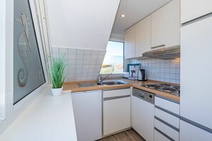 Fridge, stovetop, coffee/tea maker, toaster