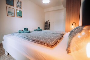 1 bedroom, desk, iron/ironing board, travel crib