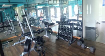 secured gated community 2-bedroom apartment with AC, fitness room, swimming pool