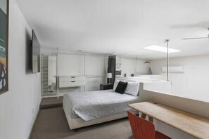 1 bedroom, desk, iron/ironing board, travel crib