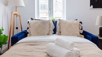 1 bedroom, desk, iron/ironing board, travel crib